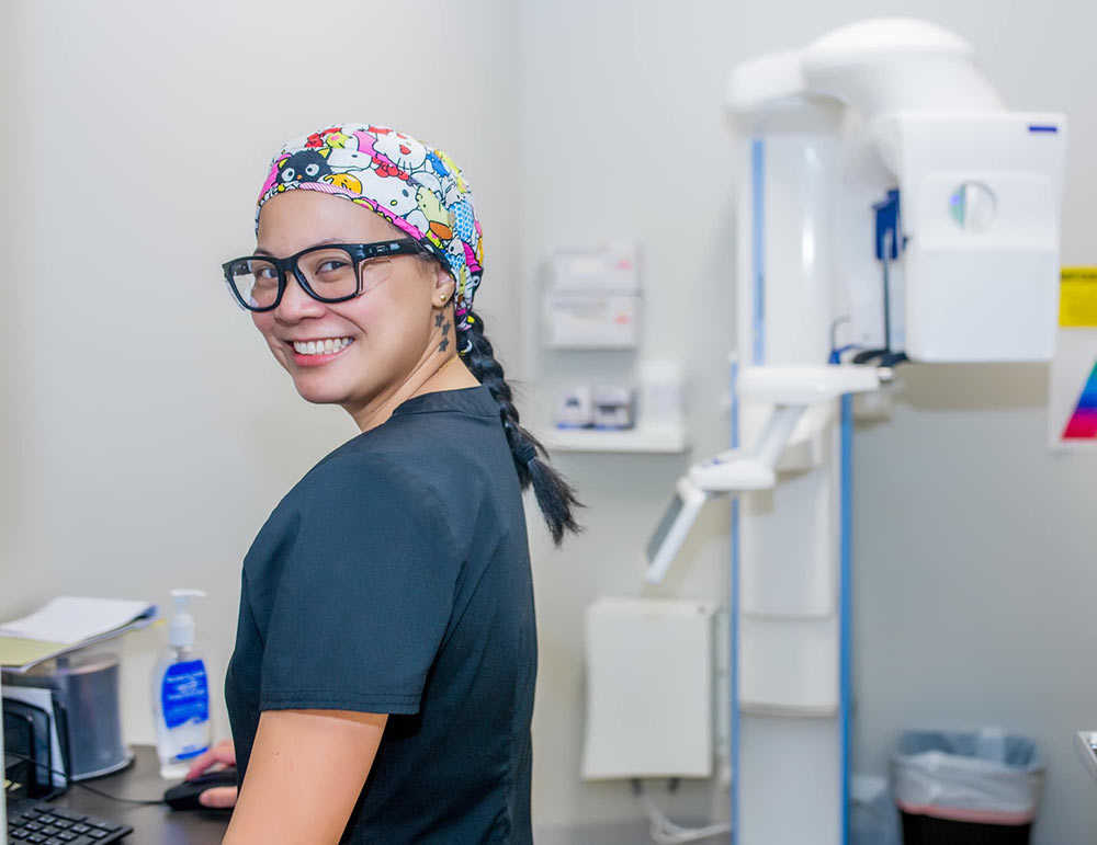 Staff member smiles at Charleston Oral and Facial Surgery.